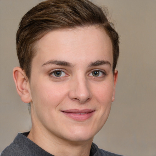 Joyful white young-adult female with short  brown hair and grey eyes