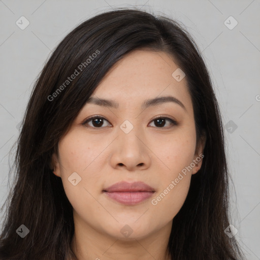 Joyful asian young-adult female with long  brown hair and brown eyes