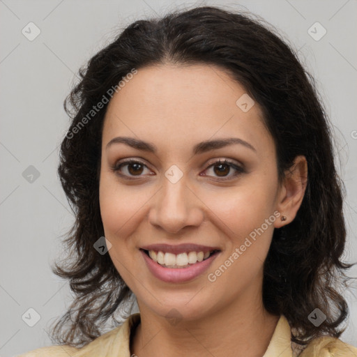 Joyful latino young-adult female with medium  brown hair and brown eyes