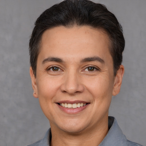 Joyful white adult female with short  brown hair and brown eyes