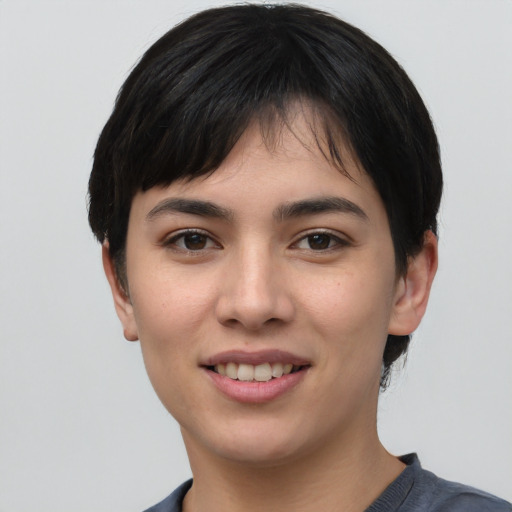 Joyful asian young-adult female with short  black hair and brown eyes