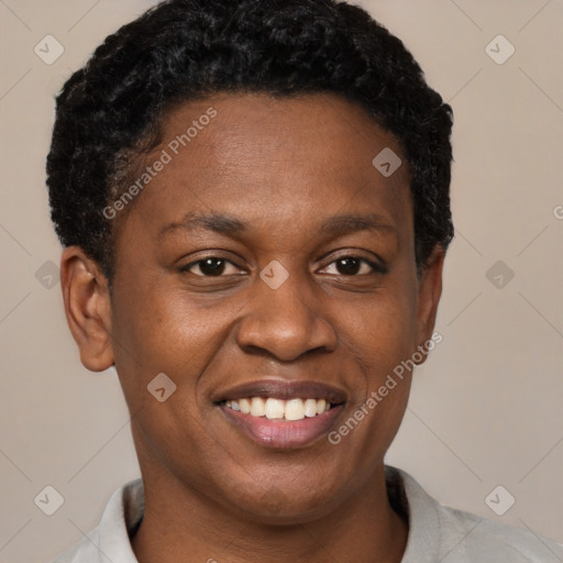 Joyful black young-adult male with short  brown hair and brown eyes