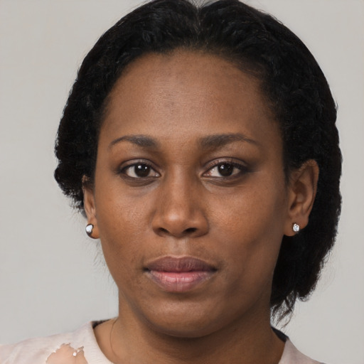 Neutral black young-adult female with medium  black hair and brown eyes