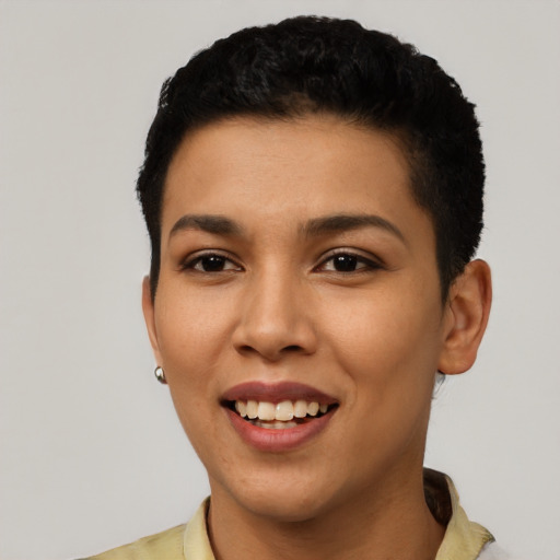 Joyful latino young-adult female with short  black hair and brown eyes