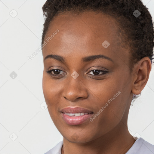 Joyful black young-adult female with short  brown hair and brown eyes