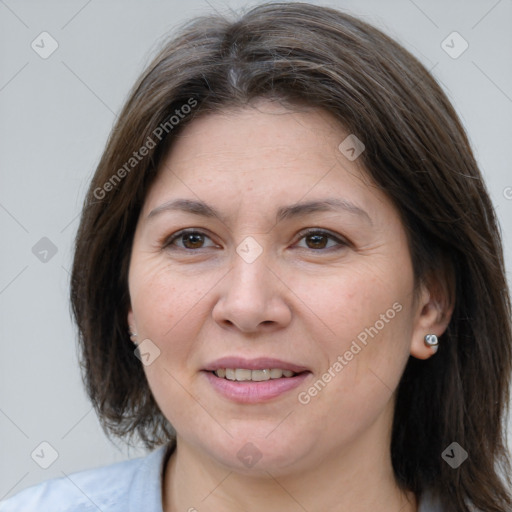 Joyful white adult female with medium  brown hair and grey eyes