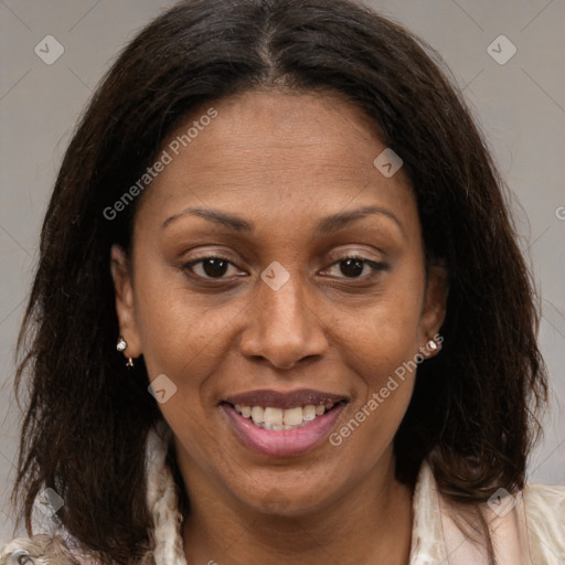 Joyful black adult female with medium  brown hair and brown eyes