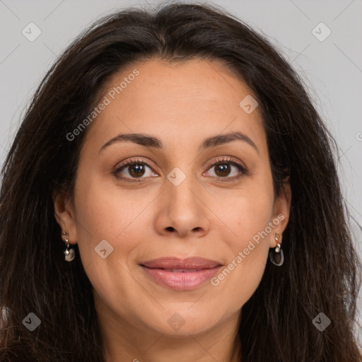 Joyful white adult female with long  brown hair and brown eyes