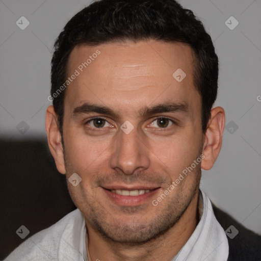 Joyful white adult male with short  brown hair and brown eyes