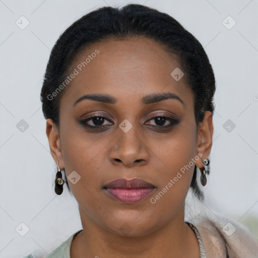 Joyful black young-adult female with short  black hair and brown eyes
