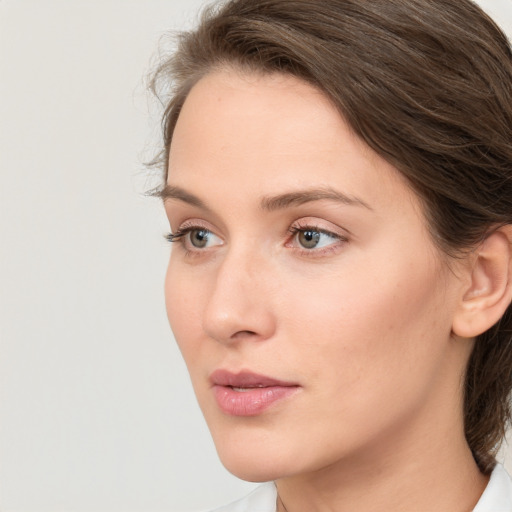 Neutral white young-adult female with medium  brown hair and grey eyes