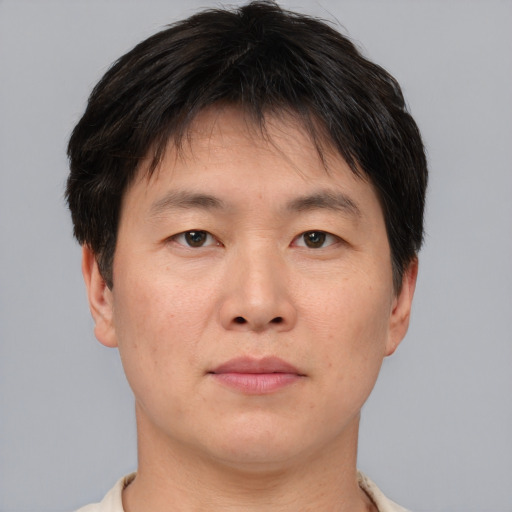 Neutral asian adult male with short  brown hair and brown eyes