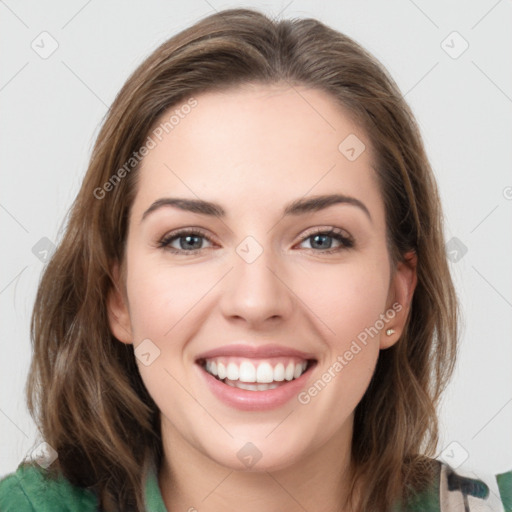 Joyful white young-adult female with medium  brown hair and green eyes