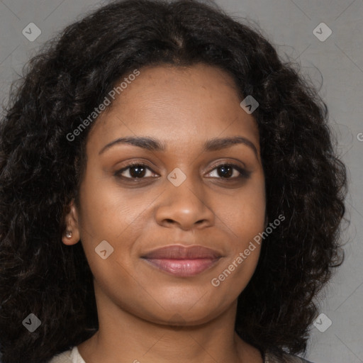 Joyful black young-adult female with long  brown hair and brown eyes