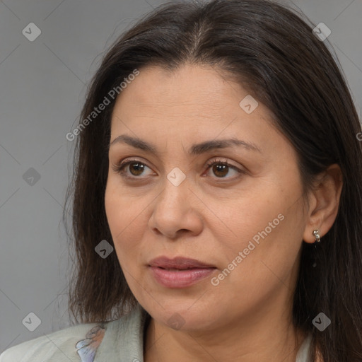 Joyful white adult female with medium  brown hair and brown eyes