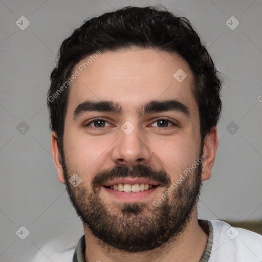 Joyful white young-adult male with short  black hair and brown eyes