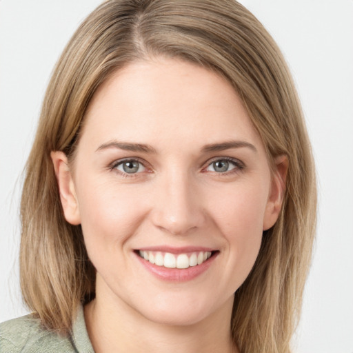 Joyful white young-adult female with medium  brown hair and blue eyes