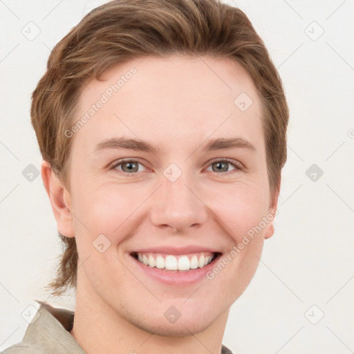 Joyful white young-adult female with short  brown hair and grey eyes