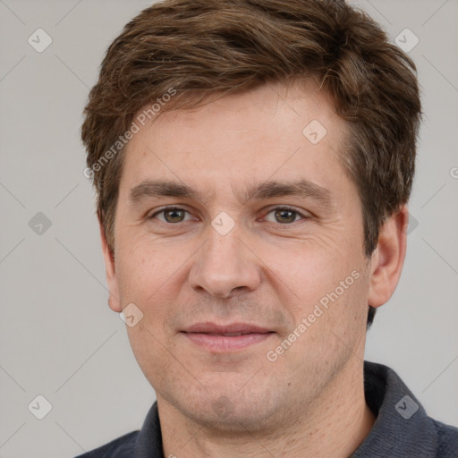 Joyful white adult male with short  brown hair and grey eyes