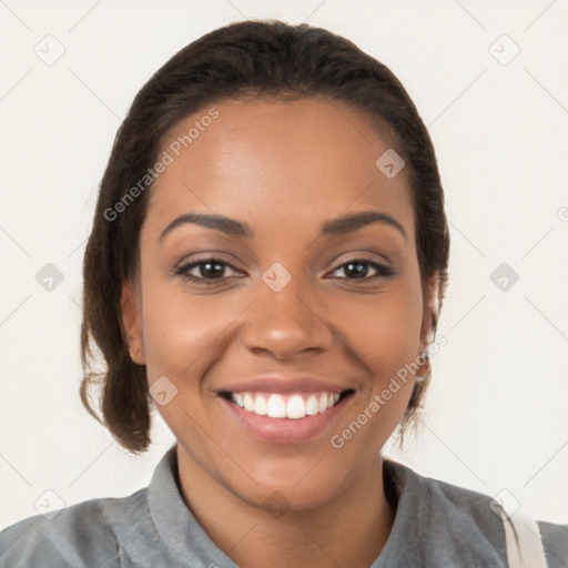 Joyful latino young-adult female with medium  brown hair and brown eyes