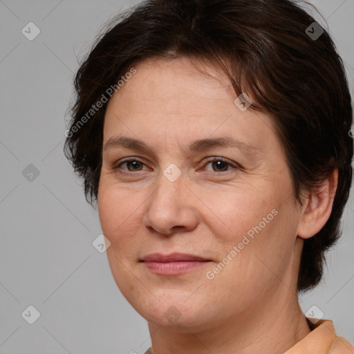 Joyful white adult female with short  brown hair and brown eyes