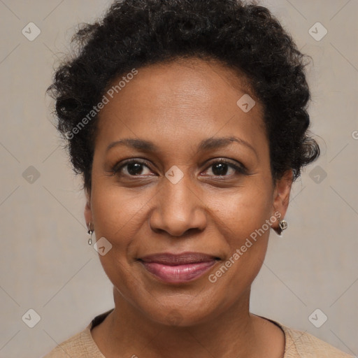 Joyful black adult female with short  brown hair and brown eyes