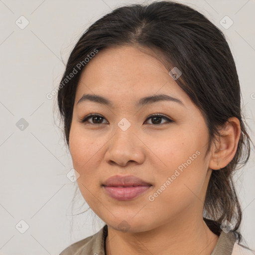 Joyful asian young-adult female with medium  brown hair and brown eyes