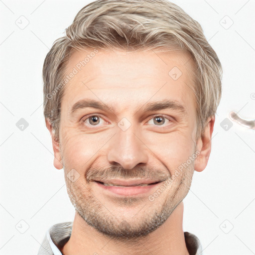 Joyful white adult male with short  brown hair and grey eyes