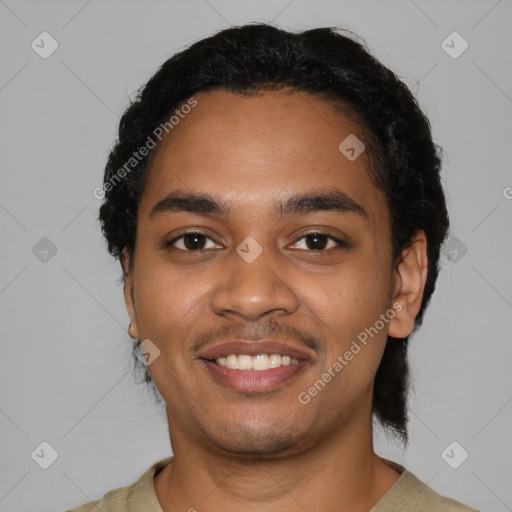 Joyful black young-adult male with short  black hair and brown eyes