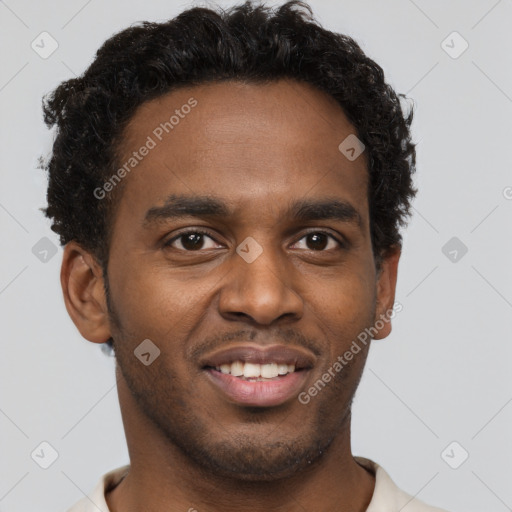 Joyful black young-adult male with short  brown hair and brown eyes