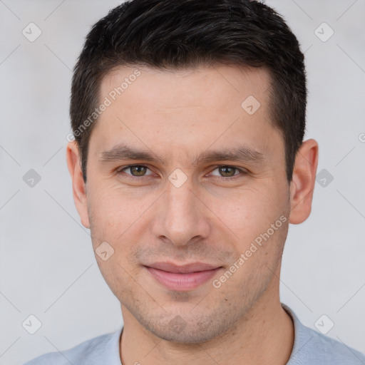 Joyful white young-adult male with short  brown hair and brown eyes