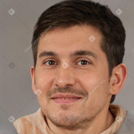 Joyful white adult male with short  brown hair and brown eyes