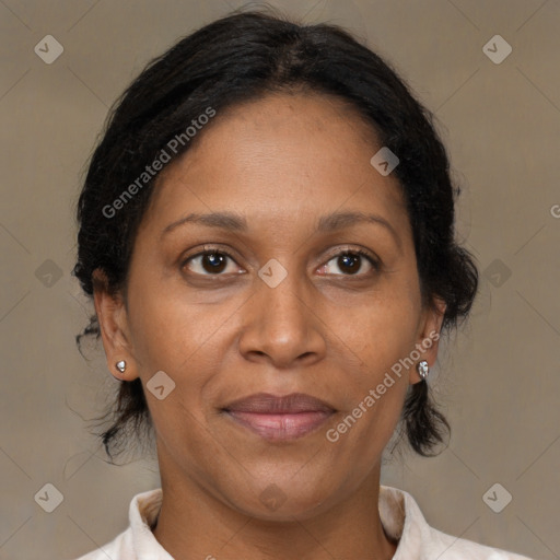 Joyful black adult female with medium  brown hair and brown eyes