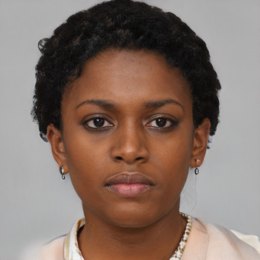 Neutral black young-adult female with short  brown hair and brown eyes