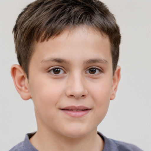 Joyful white child male with short  brown hair and brown eyes