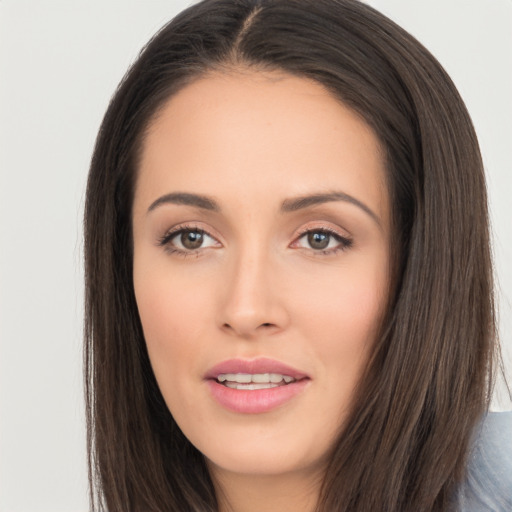 Joyful asian young-adult female with long  brown hair and brown eyes