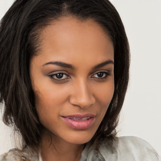 Joyful latino young-adult female with long  brown hair and brown eyes