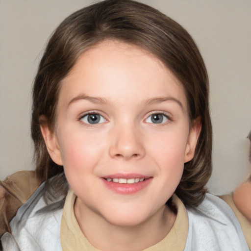 Joyful white child female with medium  brown hair and brown eyes