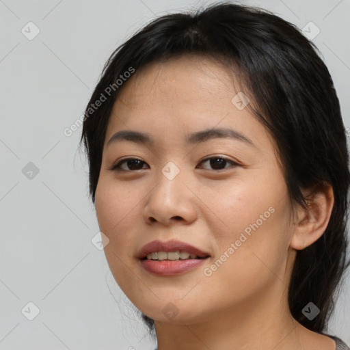 Joyful asian young-adult female with long  brown hair and brown eyes