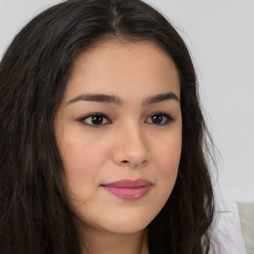 Joyful asian young-adult female with long  brown hair and brown eyes