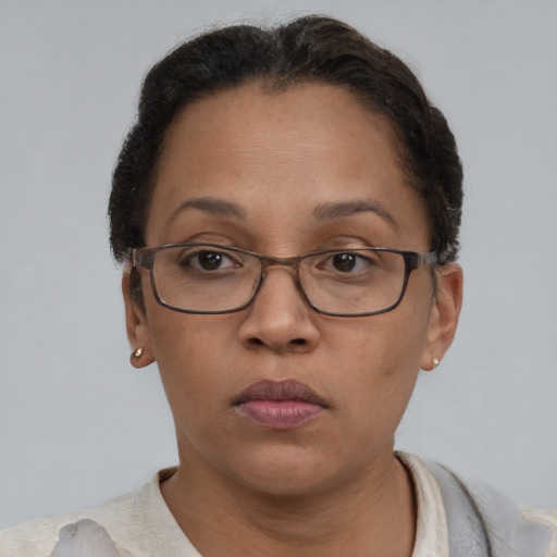 Neutral latino adult female with short  brown hair and brown eyes