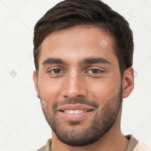 Joyful white young-adult male with short  brown hair and brown eyes