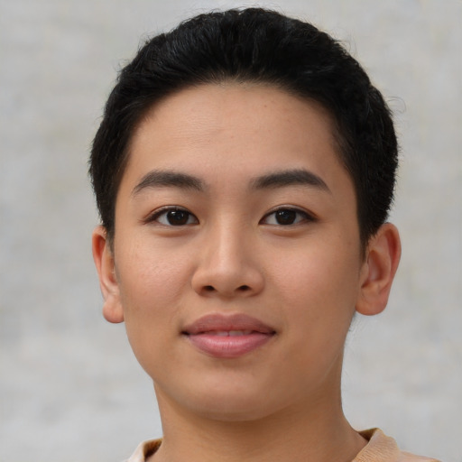 Joyful asian young-adult female with short  brown hair and brown eyes