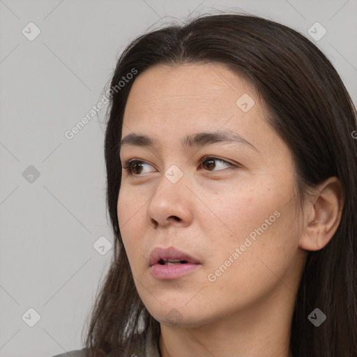 Neutral white young-adult female with long  brown hair and brown eyes