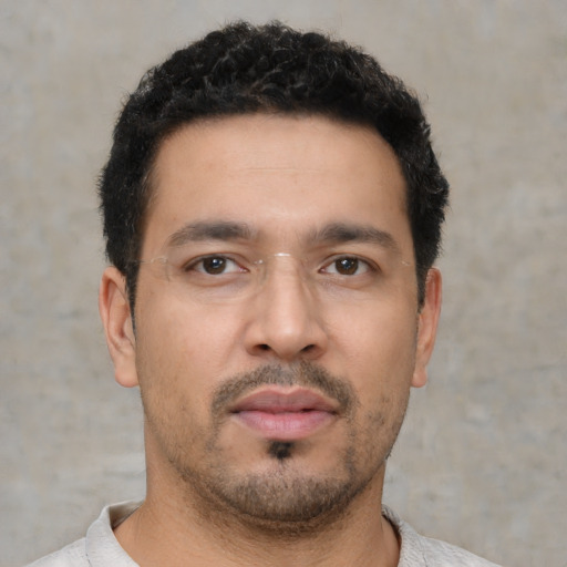 Neutral white young-adult male with short  black hair and brown eyes