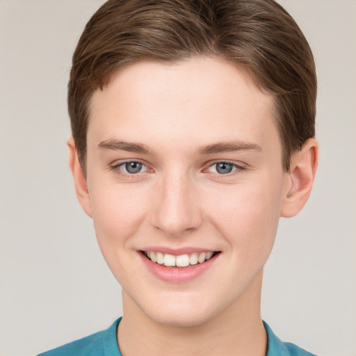 Joyful white young-adult female with short  brown hair and grey eyes