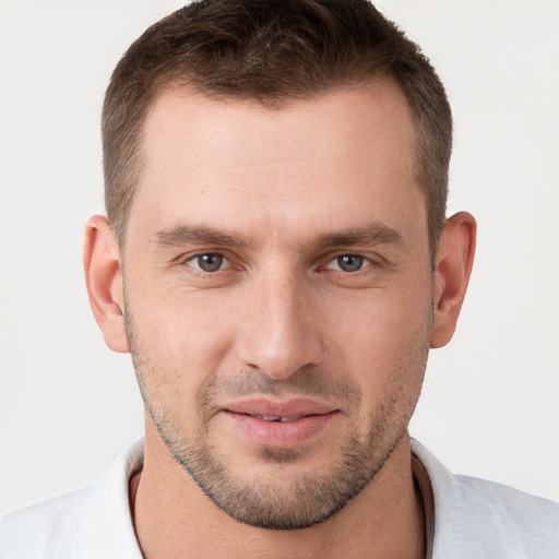 Joyful white young-adult male with short  brown hair and brown eyes