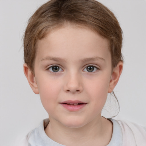 Joyful white child female with short  brown hair and grey eyes