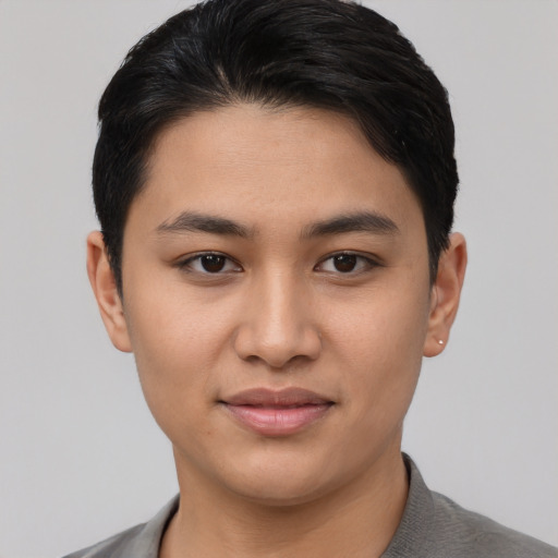 Joyful asian young-adult female with short  black hair and brown eyes