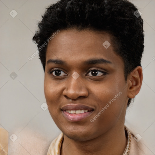 Joyful black young-adult male with short  brown hair and brown eyes